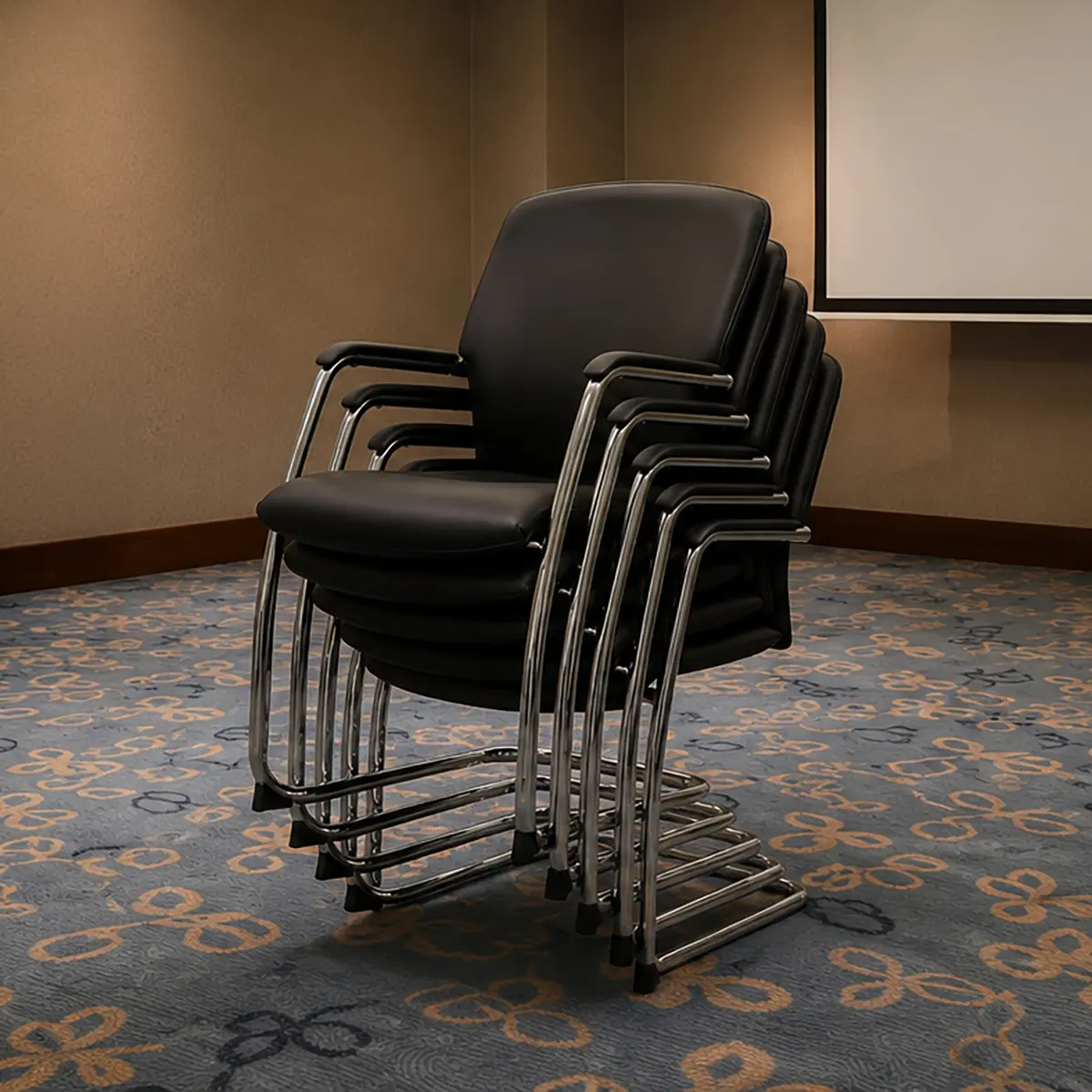 Black upholstered Forum chairs nested seat-on-seat in a stack