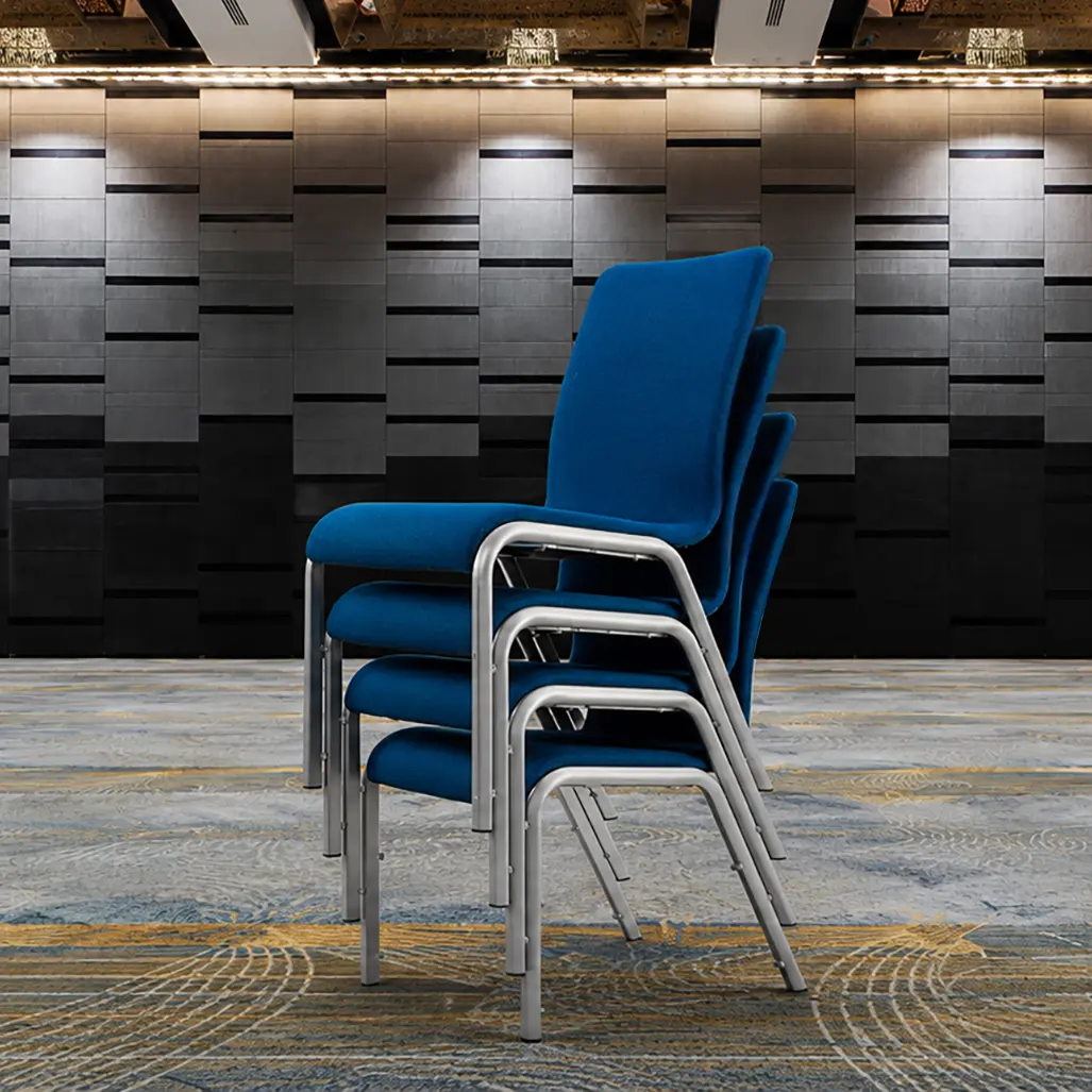 Blue upholstered Mendola chairs stacked leg-on-leg using their metal frames